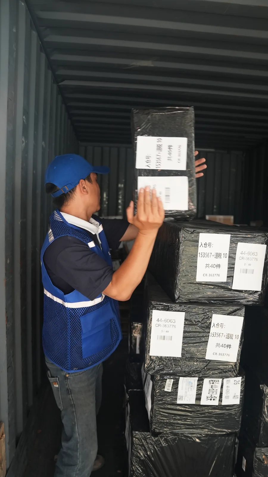 UTEC staff stowing export cargo inside a shipping container